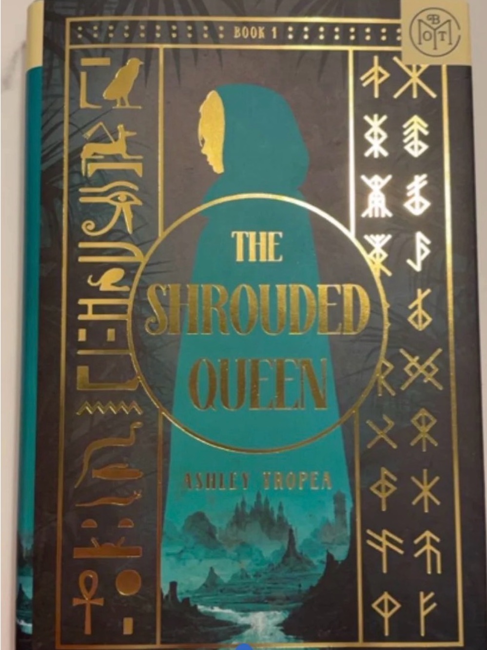 The Shrouded Queen by Ashley Tropea - Teal & Gold Hardcover